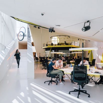 Students studying in a bright studio space