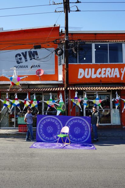 Colourful pink and green chair on a street in Mexico