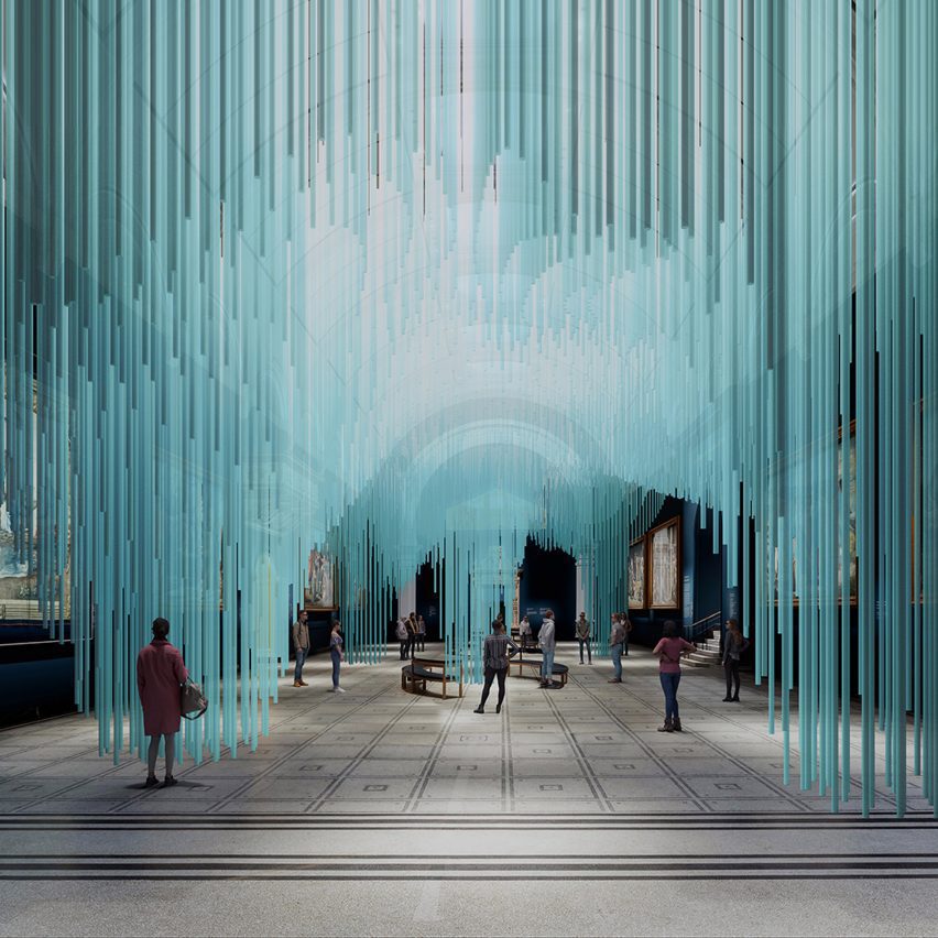 Visitors walking through a blue light installation