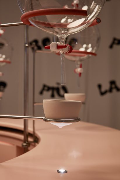 Breast shaped ceramic cup with nipple in a metal holder from Clockwork Orange milk bar installation