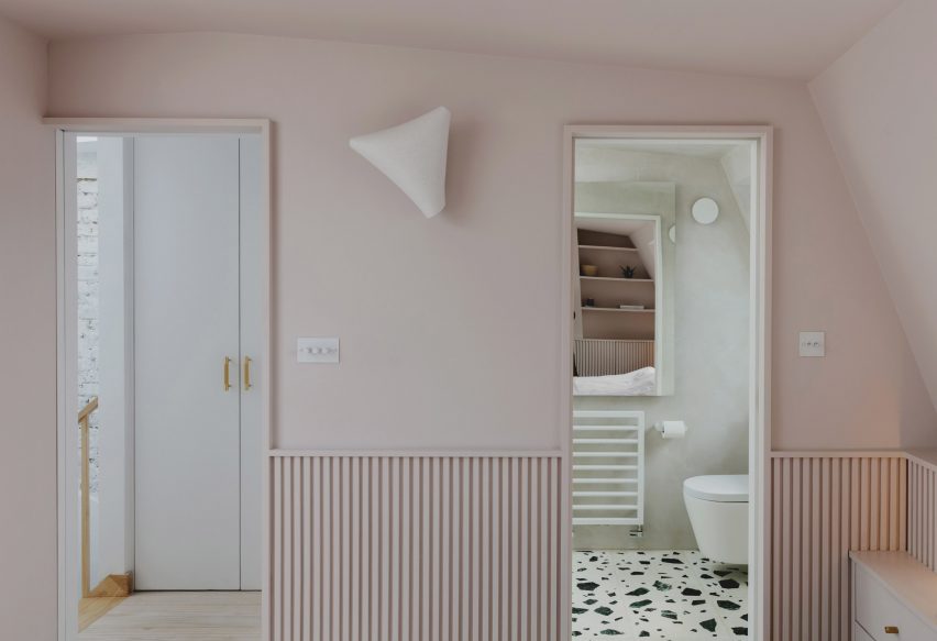 En-suite bathroom in Bed and window in Narford Road loft extension by Emil Eve Architects