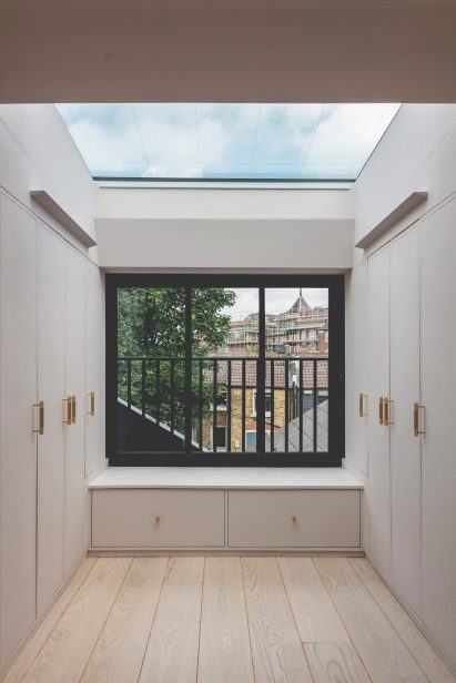 Wardrobes in Narford Road house by Emil Eve Architects