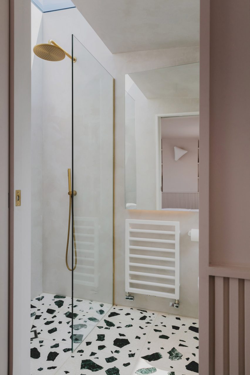 Shower in Bed and window in Narford Road loft extension by Emil Eve Architects