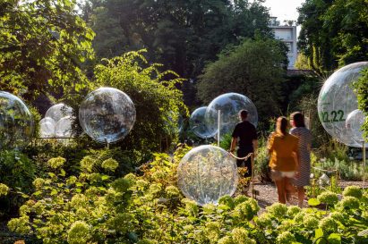 People stroll through the Natural Capital installation at Brera Botanical Garden