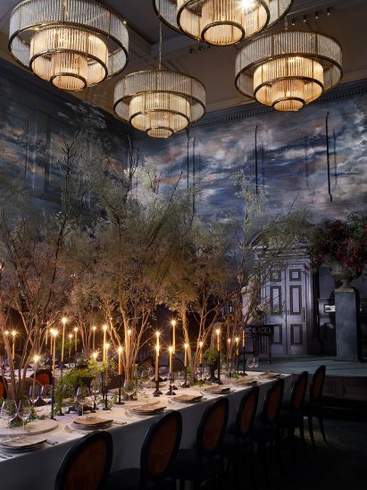 Ballroom interior by Roman and Williams with tiered chandeliers