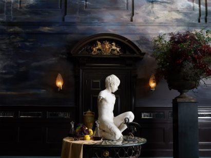 Statue with still life in ballroom of NoMad London hotel