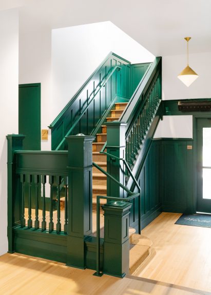 A traditional green staircase in the hotel