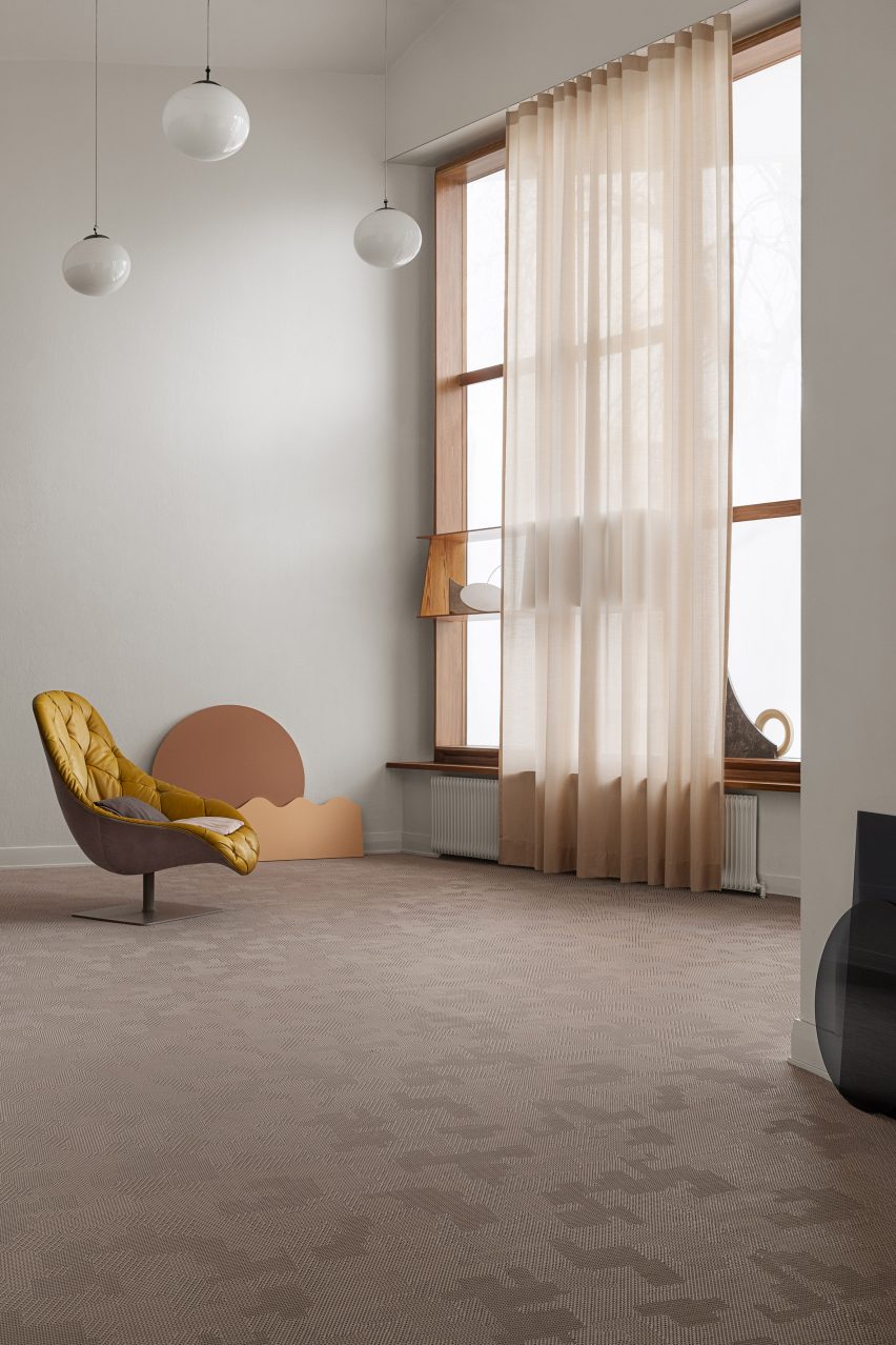 A yellow chair on Bolon flooring