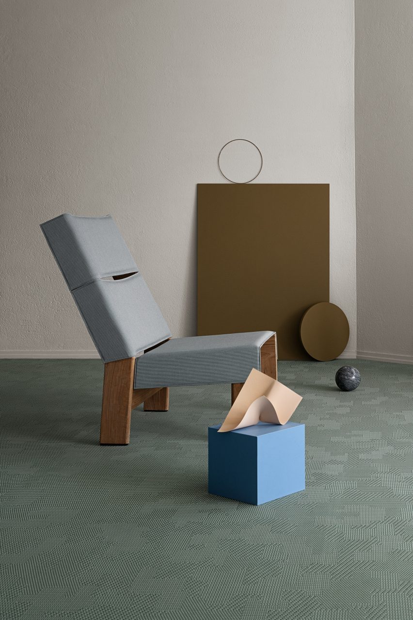 A blue chair on a turquise floor by Bolon
