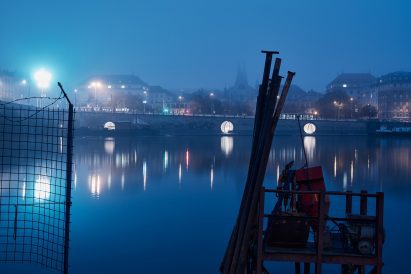 The Prague waterfront is illuminated by the public space