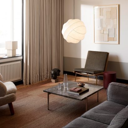 The turner pendant light hanging in a living room