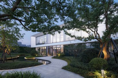 Trees and shrubbery are planted around paths at Sunac Yunyang in Huanan