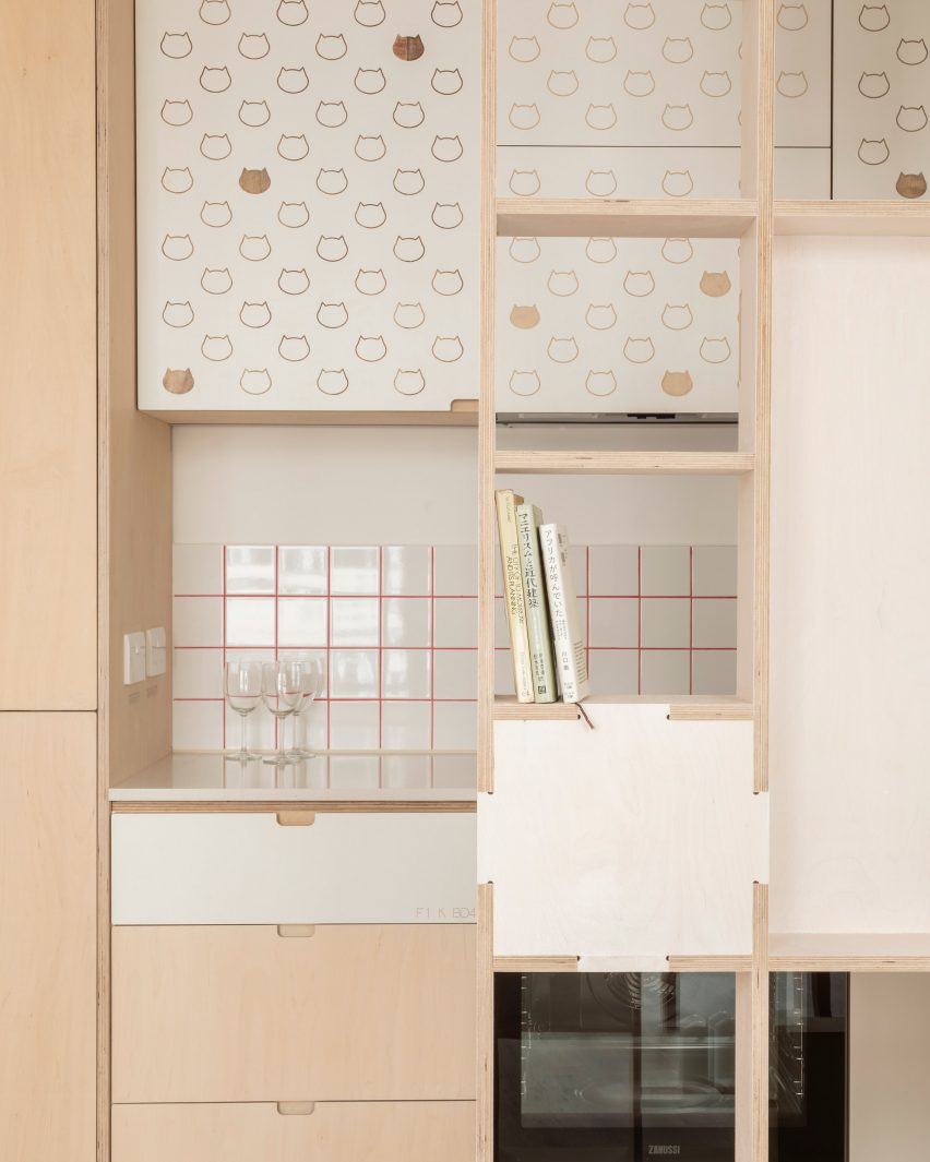 Kitchen with cat details in The Queen of Catford by Tsuruta Architects