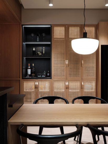Kitchen with rattan doors in Residence W