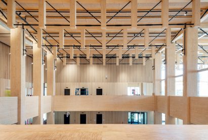 Wood-lined foyer by White Arkitekter