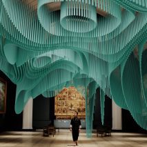 A man walks through a virtual green installation