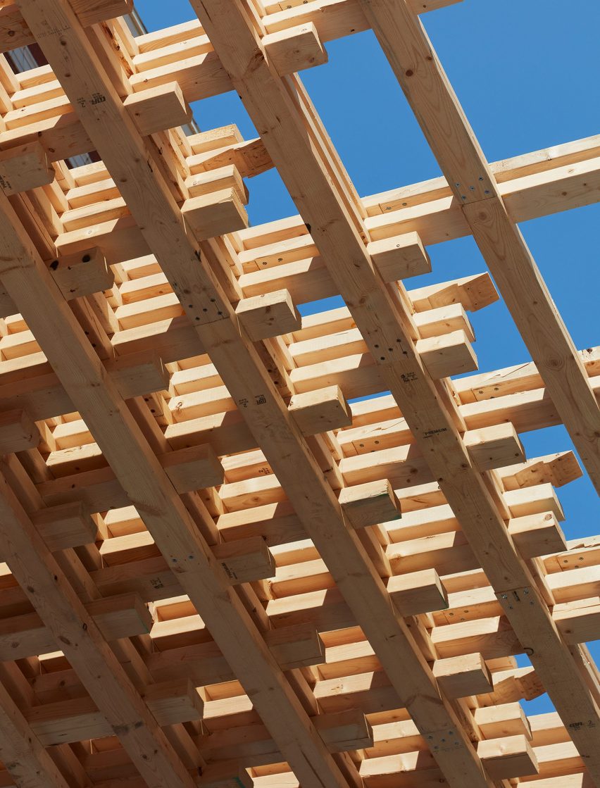 Interlocking wood pieces forming a spatially laminated timber structure by SOM architects