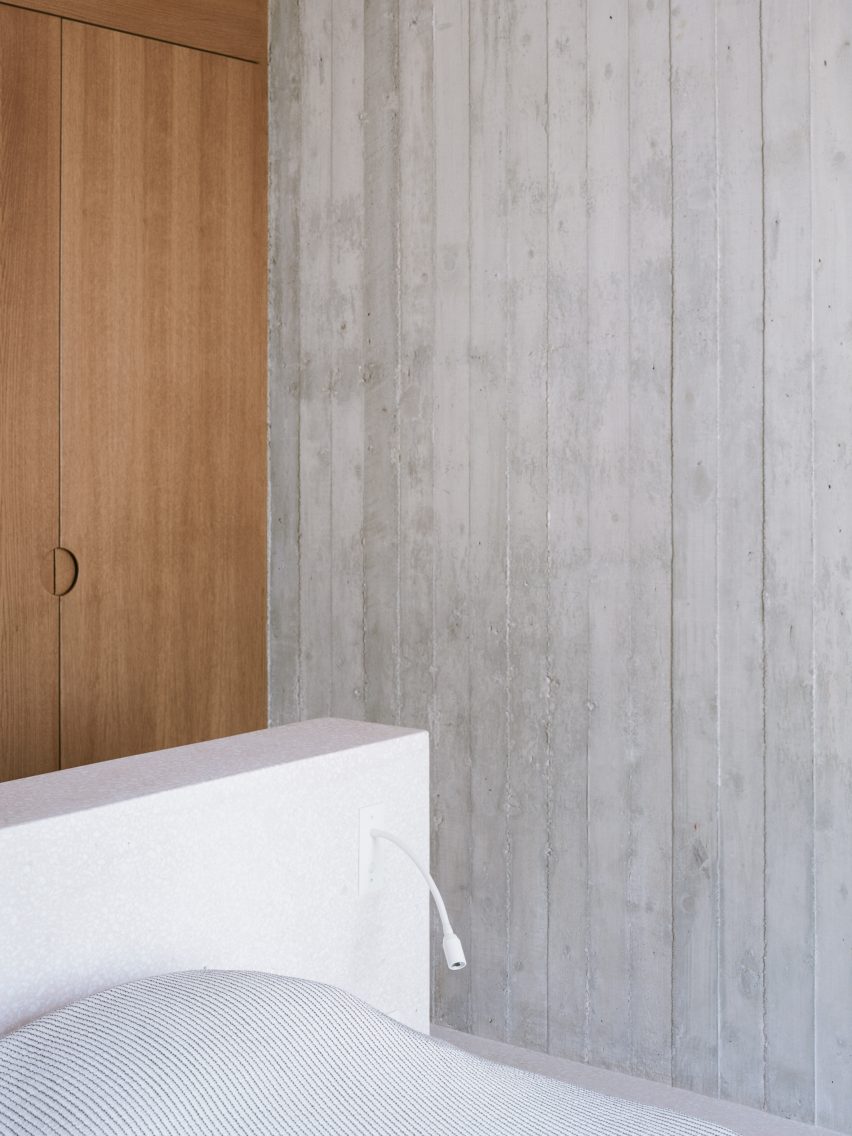 Bedroom with concrete walls