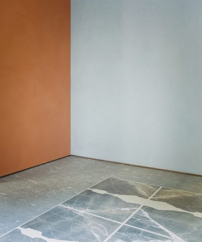 Wall and flooring made of waste marble and stone in The Stone House exhibition