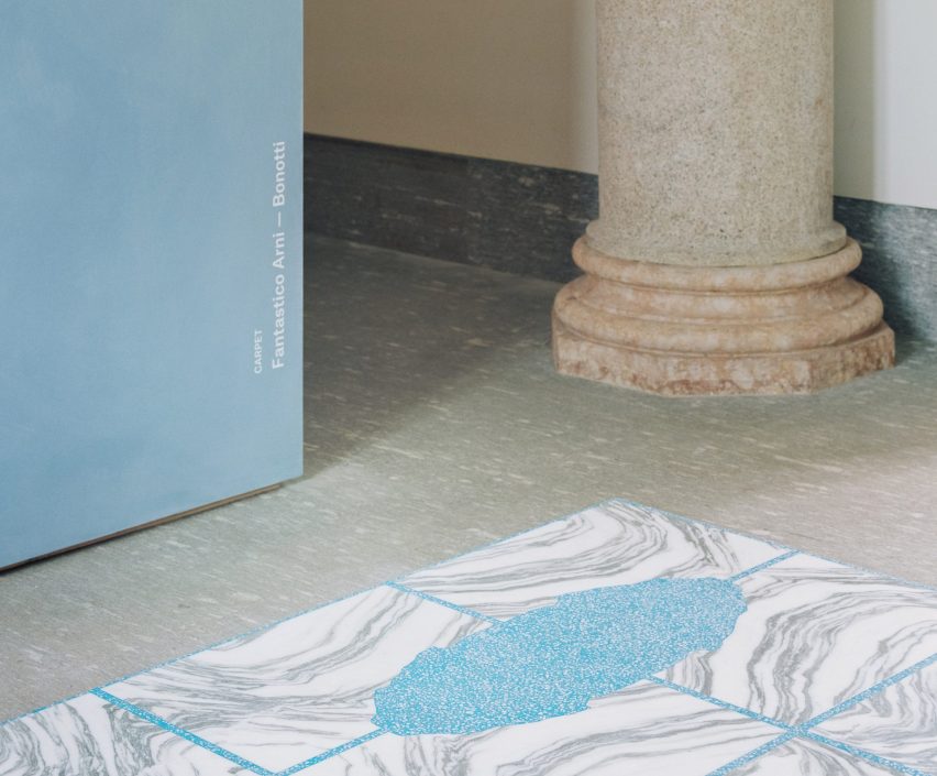 Close-up of the Stone House carpet with book-match pattern in blue and white stone