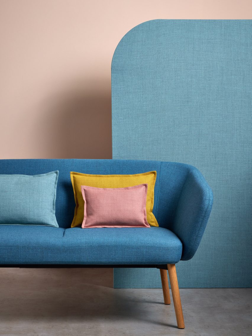 A sofa and cushions upholstered in Sumi fabric