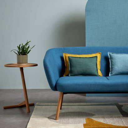 A sofa and cushions covered in Sumi fabric