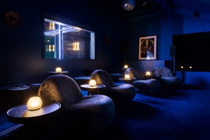 A cinema room is dimly lit