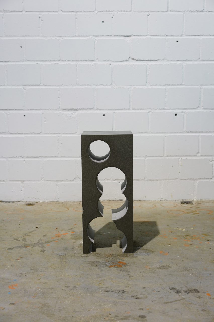 Teil 4 tall Silbergrau QS side table with pattern of holes rising through its middle