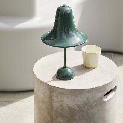 A green pantop light on a white table