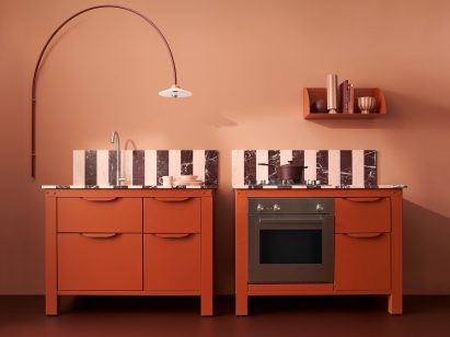 Two pink and red kitchen units by Very Simple Kitchen