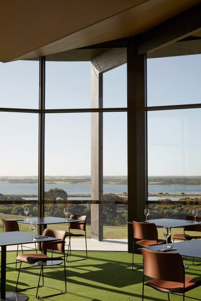 Tables and chairs were organised beside floor to ceiling windows