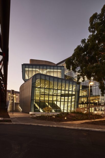Glass walls an elevation of the stacked zinc-clad volumes