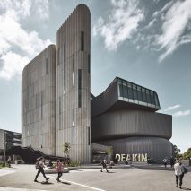 Deakin Law School by Woods Bagot features zinc cladding and fluted concrete towers