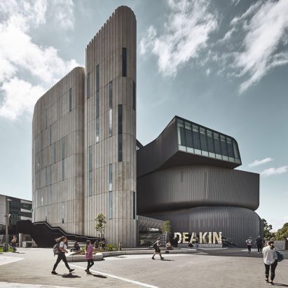 Deakin Law School by Woods Bagot features zinc cladding and fluted concrete towers