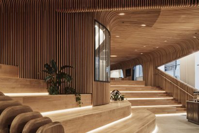 Wooden steps for sitting in Melbourne retail interior by Woods Bagot