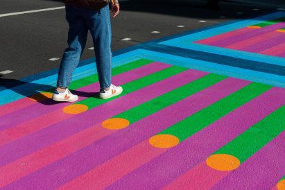 Feet walking over Yinka Ilori crossings for Bring London Together
