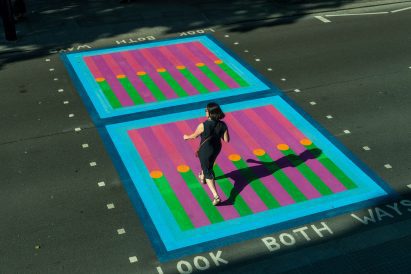 Pedestrian walking over Yinka Ilori crossings for Bring London Together