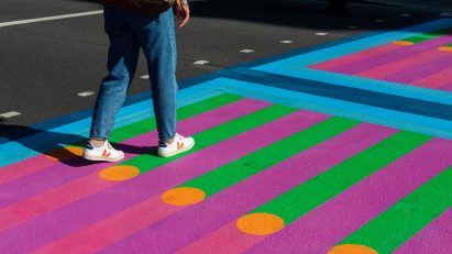 Feet walking over Yinka Ilori crossings for Bring London Together