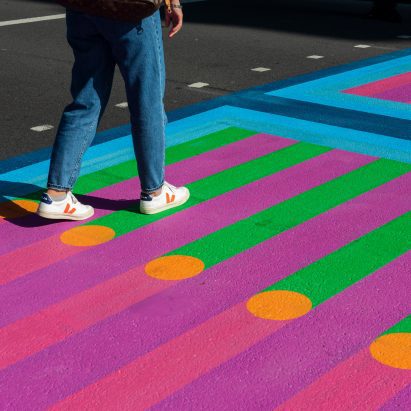 Feet walking over Yinka Ilori crossings for Bring London Together