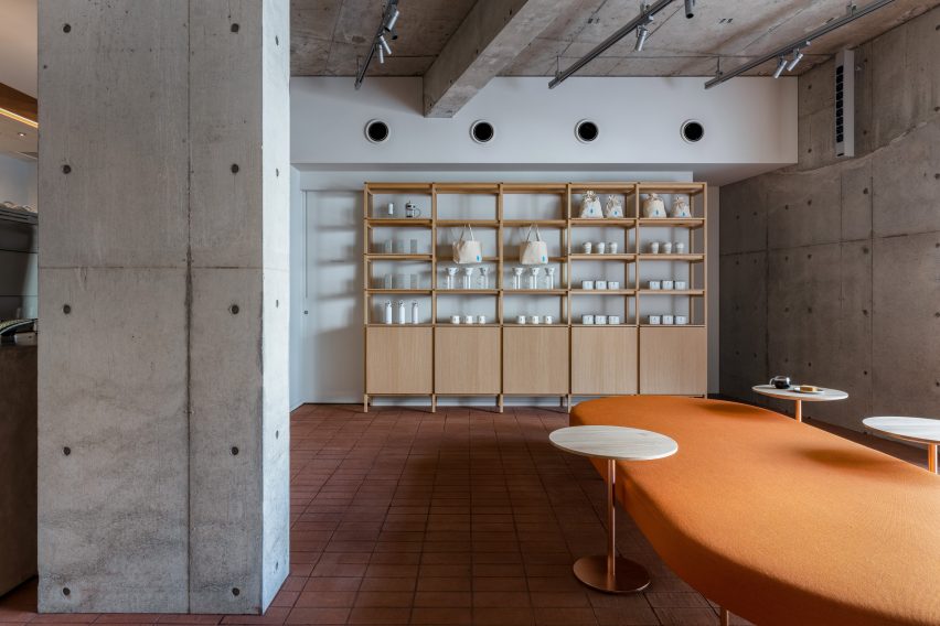 Concrete pillar and orange furniture