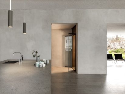 A photograph of an open-plan kitchen with an open HomeLift from the side