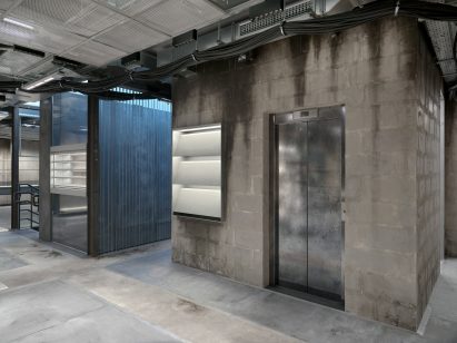 Breeze blocks surround an elevator core 