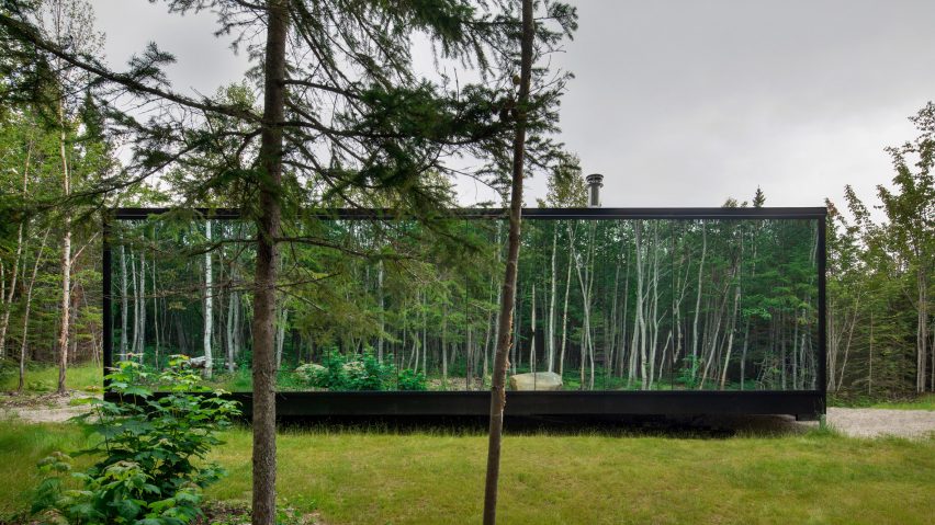 The cabin has reflective glass walls