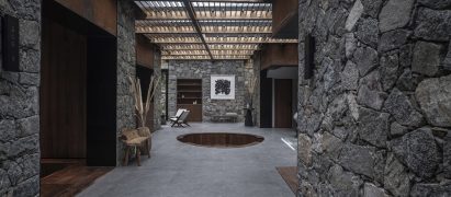 Sunken seating pit in Cloud of Hometown Resort Hotel surrounded by rough stone walls