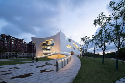The exterior of a concrete building by Steven Holl