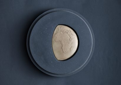 A blue and gold Earthshot Prize medal