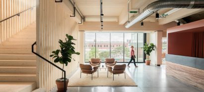 Office reception with rammed earth desk in Denver, Colorado