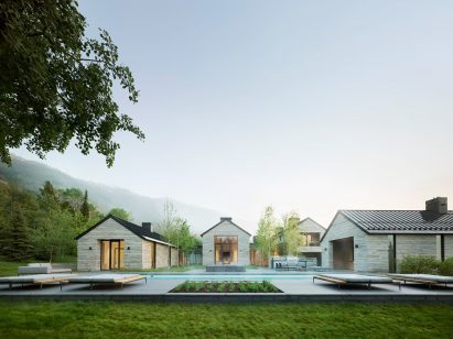 Gabled roof structures are organised around a pool