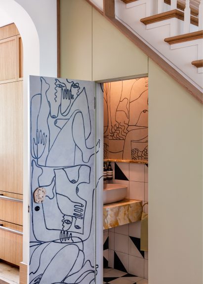 Powder room with Picasso-inspired mural