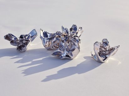 Five silver aluminium perfume bottle caps